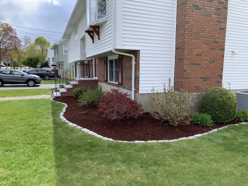 A house with a lawn in front of it.