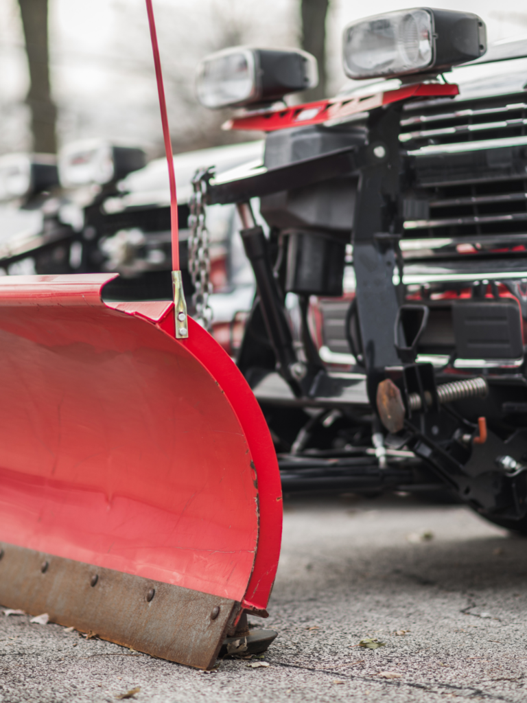A red snow plow.