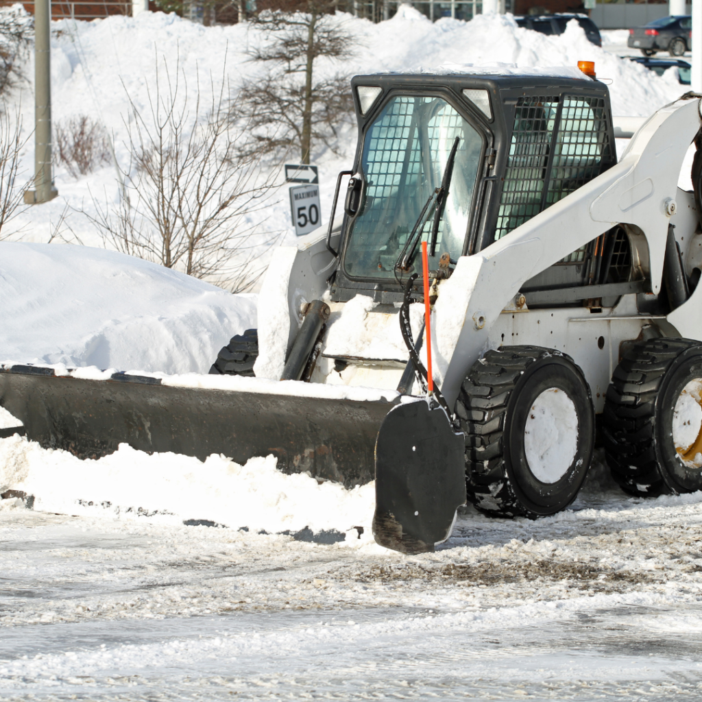 A black and white skid steer.